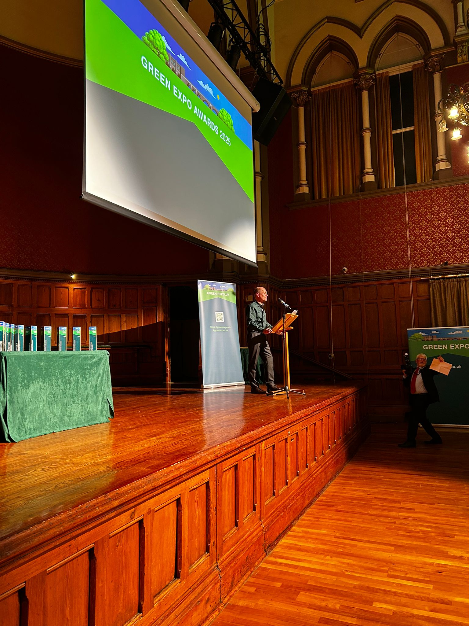 Stage at Green Expo Awards with Green Expo banner