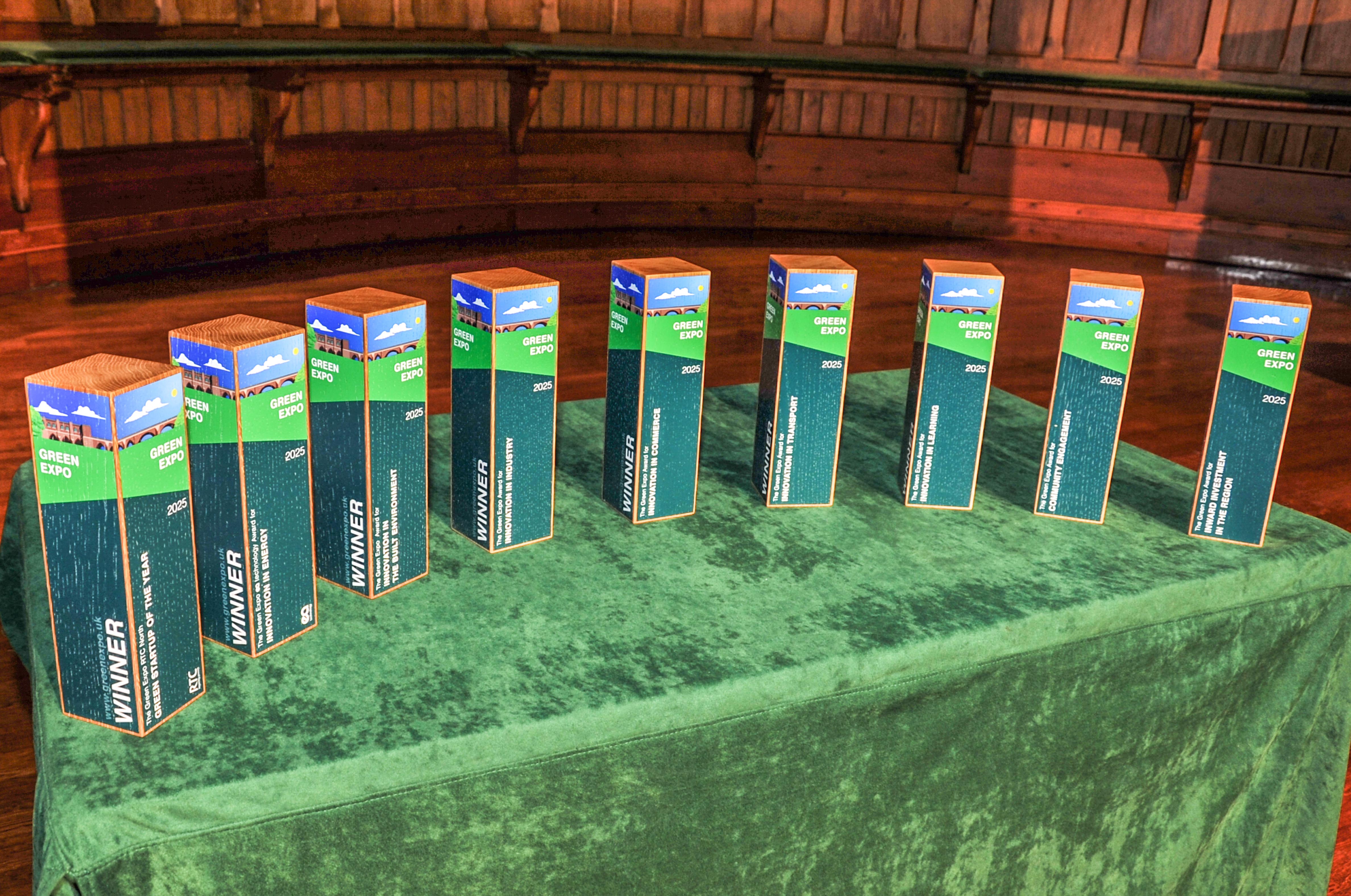 Row of Green Expo award trophies